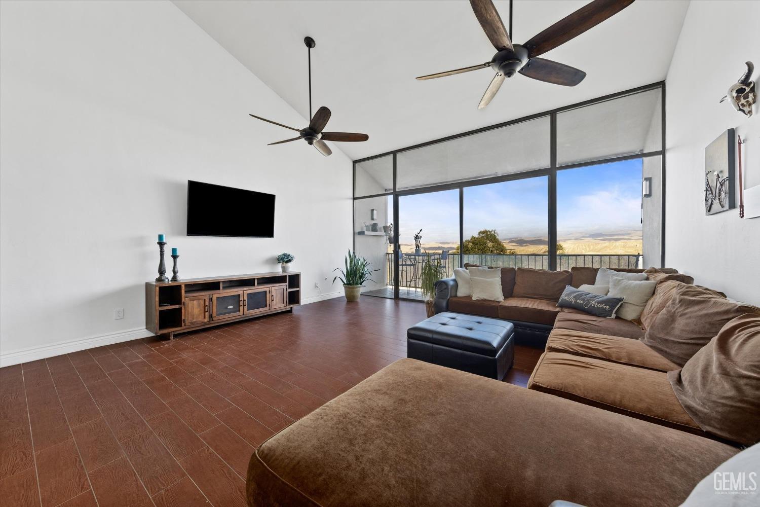 Undisclosed Address Bakersfield, CA 93306 - Photo 16 of 52 a living room with furniture and a flat screen tv