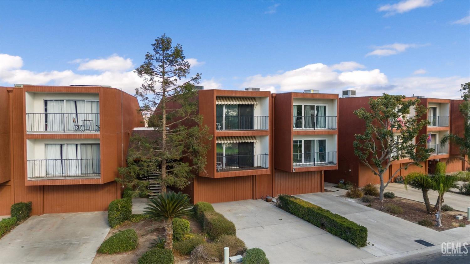 Undisclosed Address Bakersfield, CA 93306 - Photo 2 of 52 a front view of a house with a yard