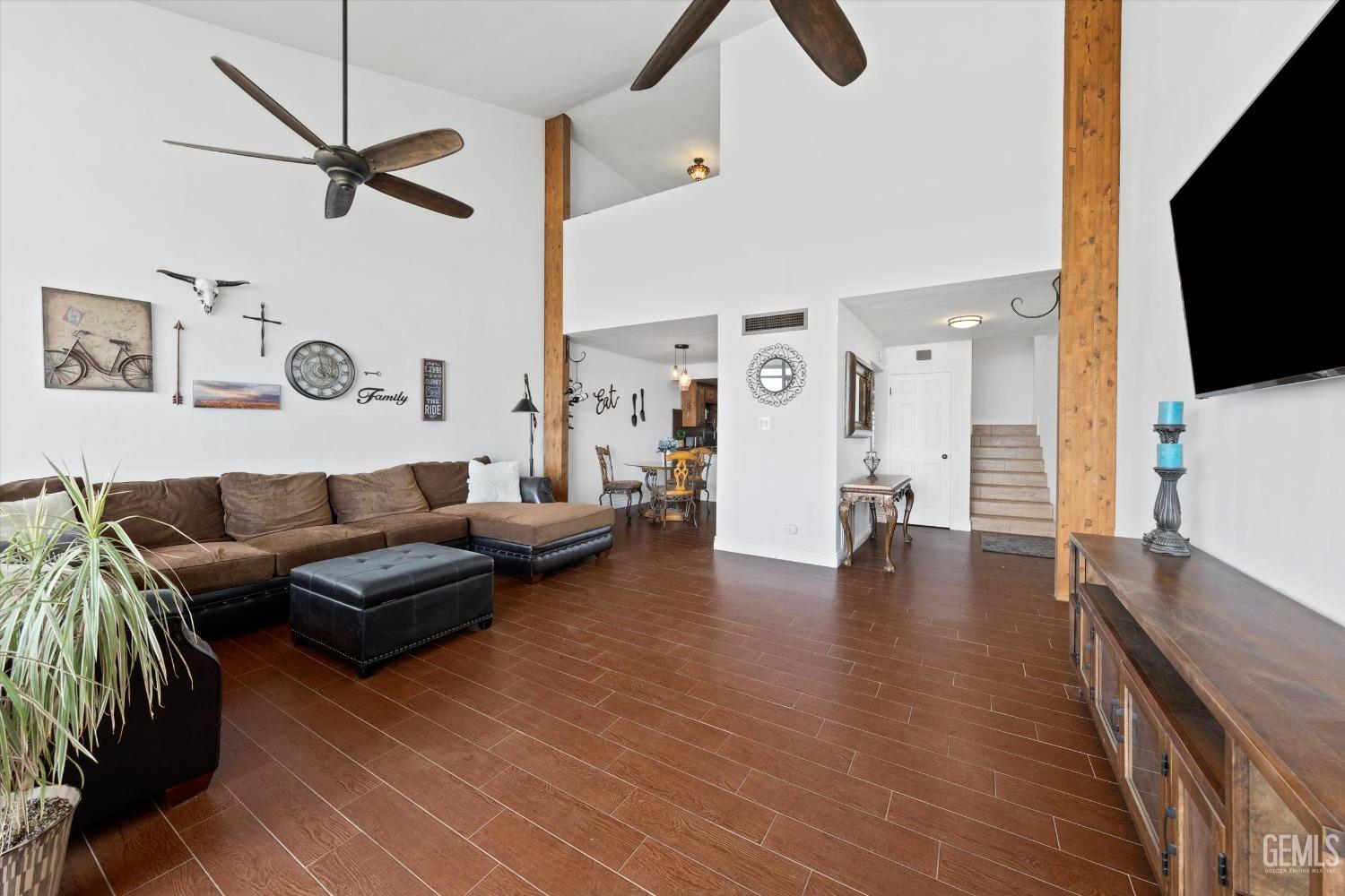 Undisclosed Address Bakersfield, CA 93306 - Photo 52 of 52 a living room with furniture and a flat screen tv