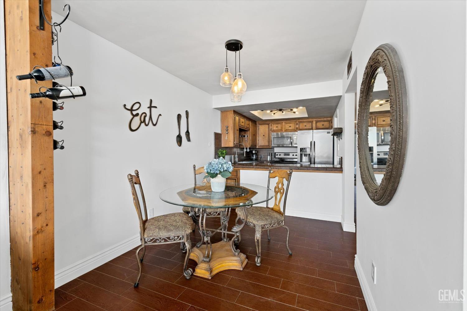 Undisclosed Address Bakersfield, CA 93306 - Photo 21 of 52 a view of a dining room with furniture and a chandelier