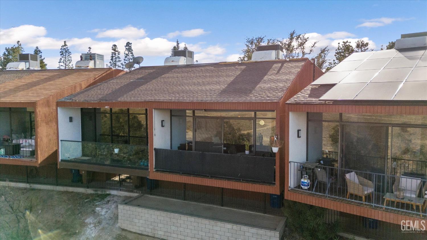 Undisclosed Address Bakersfield, CA 93306 - Photo 4 of 52 a front view of a house with a yard