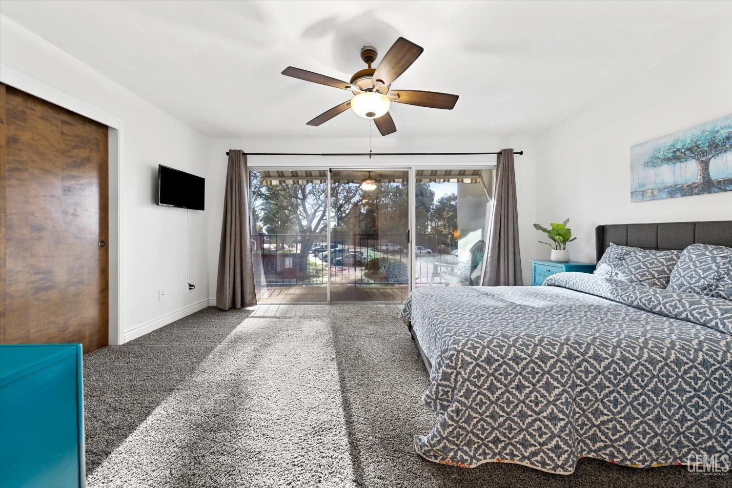 Undisclosed Address Bakersfield, CA 93306 - Photo 41 of 52 a living room with a bed furniture and a large window