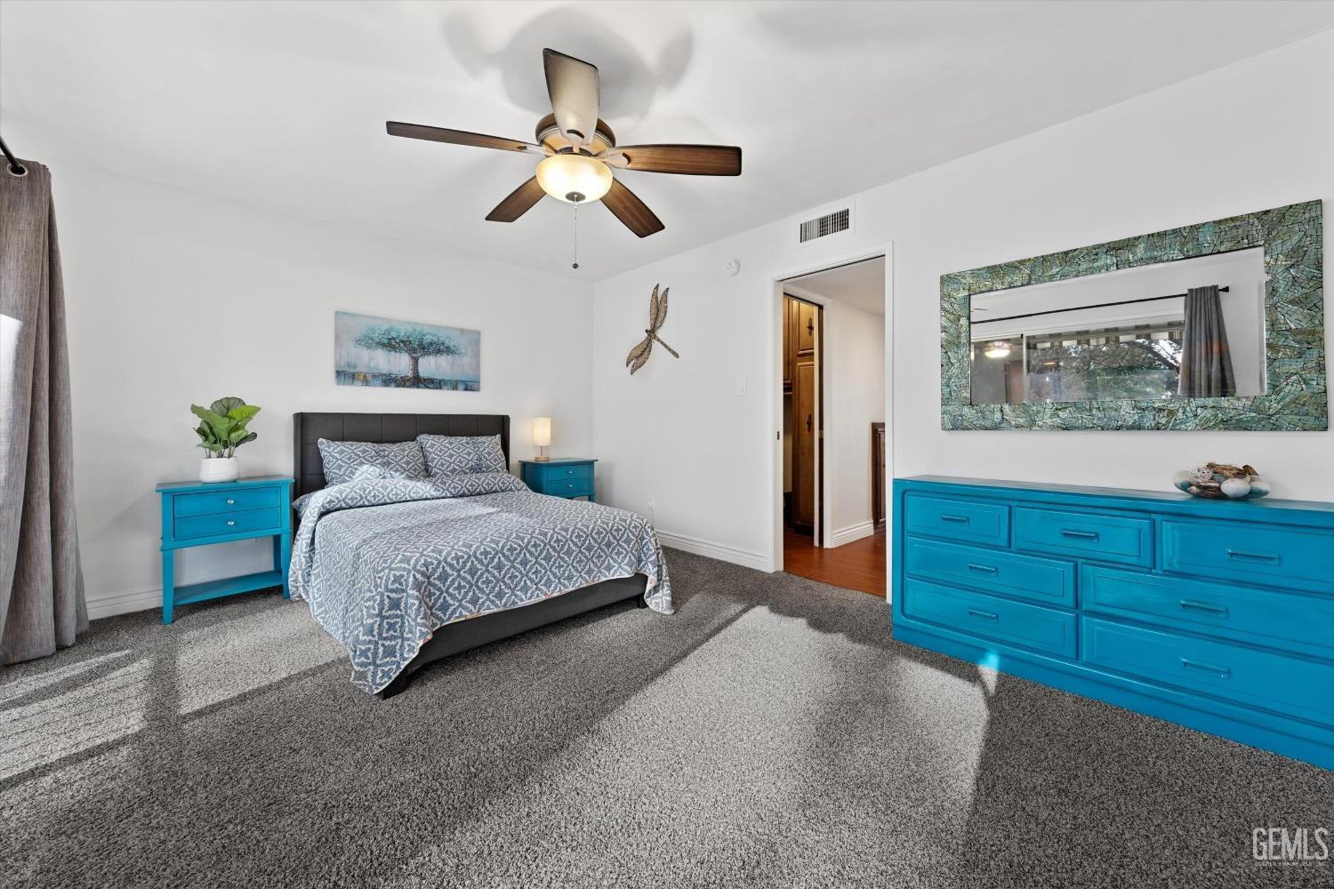 Undisclosed Address Bakersfield, CA 93306 - Photo 42 of 52 a bedroom with a bed and a dresser