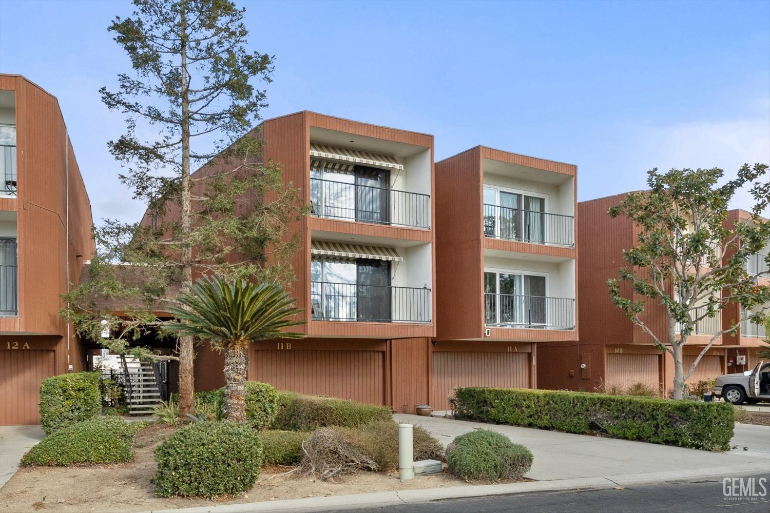 Undisclosed Address Bakersfield, CA 93306 - Photo 10 of 52 a front view of a house with a yard