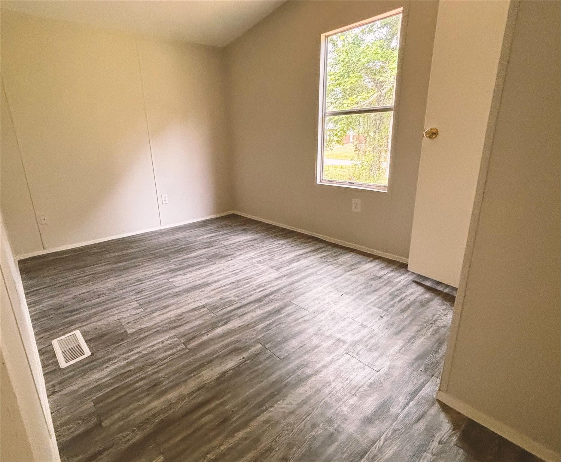 253 County Road 320 Cleveland, TX 77327 - Photo 5 of 13 a view of an empty room and window