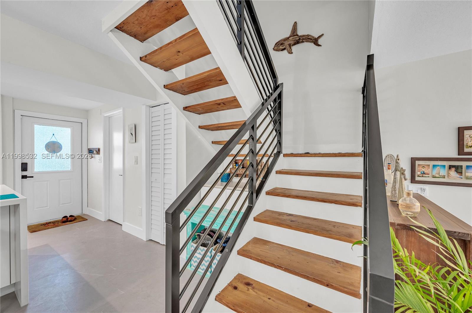 7018 Southwest 53rd Lane Miami, FL 33155 - Photo 11 of 58 a view of an entryway with staircase