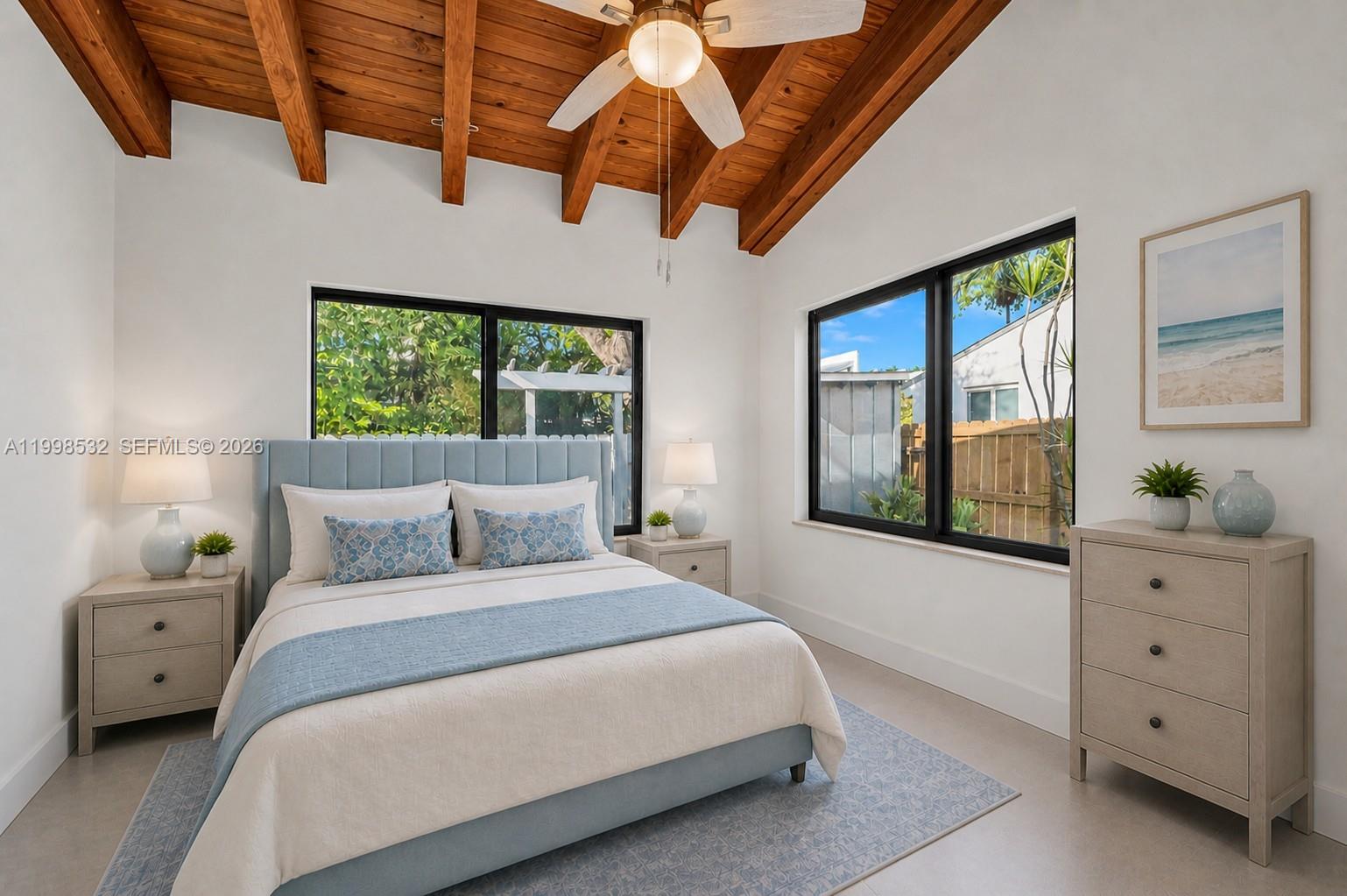 7018 Southwest 53rd Lane Miami, FL 33155 - Photo 20 of 59 a bedroom with a large bed and a window