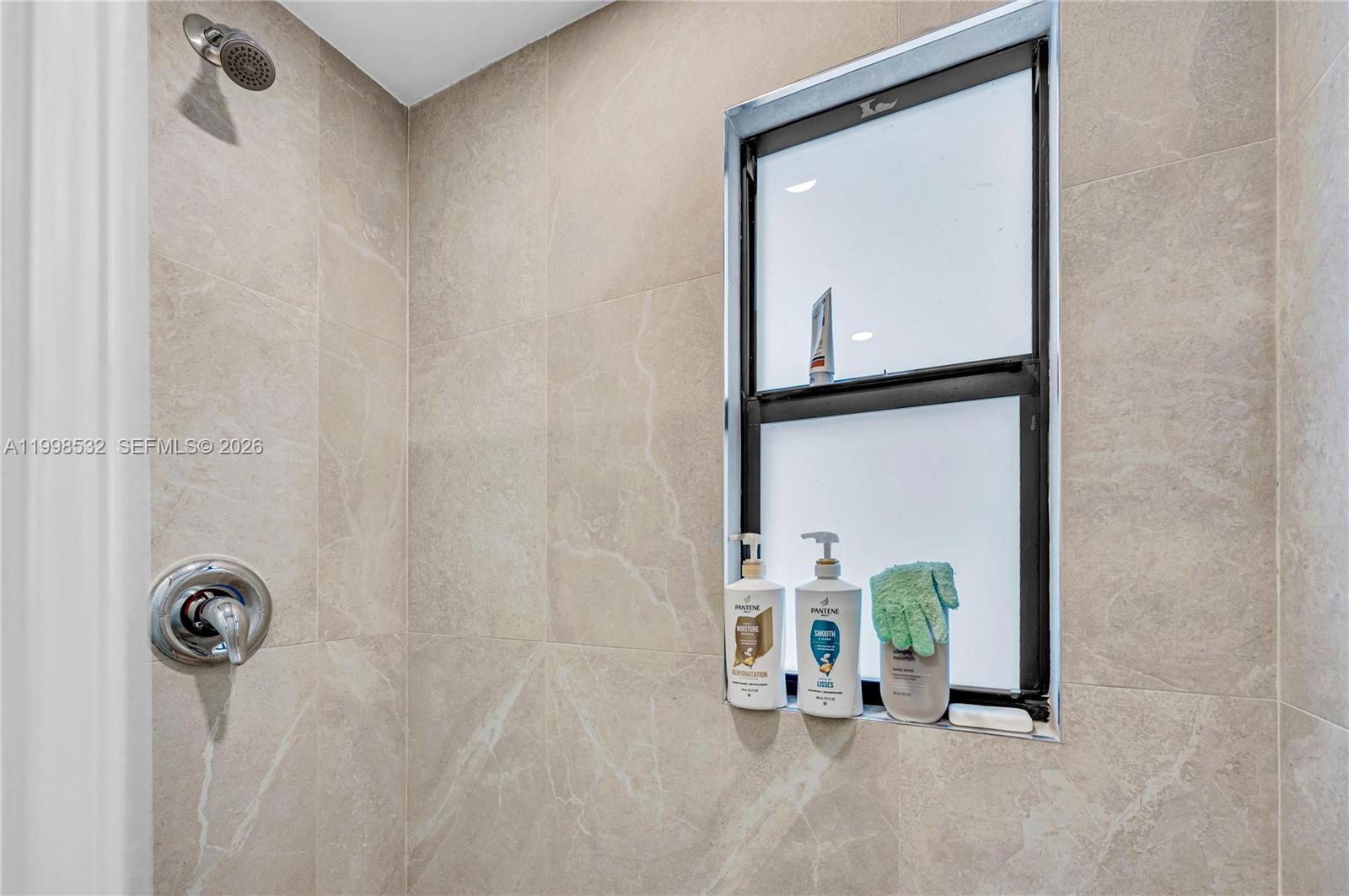 7018 Southwest 53rd Lane Miami, FL 33155 - Photo 22 of 58 a view of an entryway with table and mirror