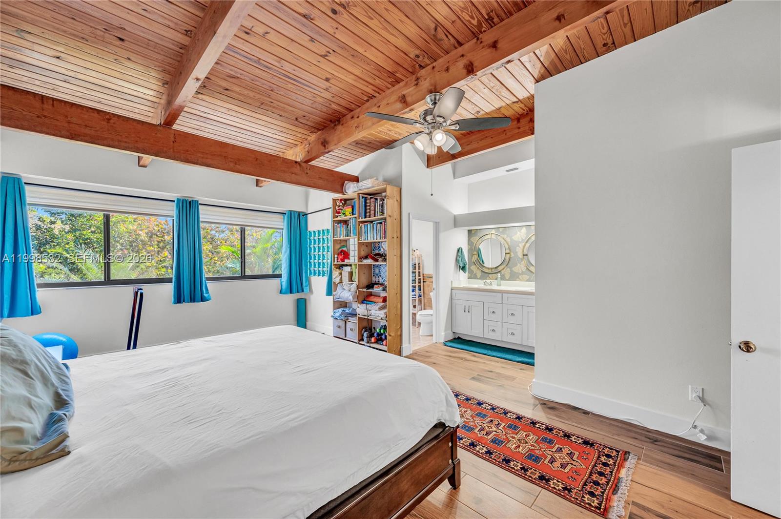 7018 Southwest 53rd Lane Miami, FL 33155 - Photo 25 of 58 a bed sitting in a bedroom next to a window