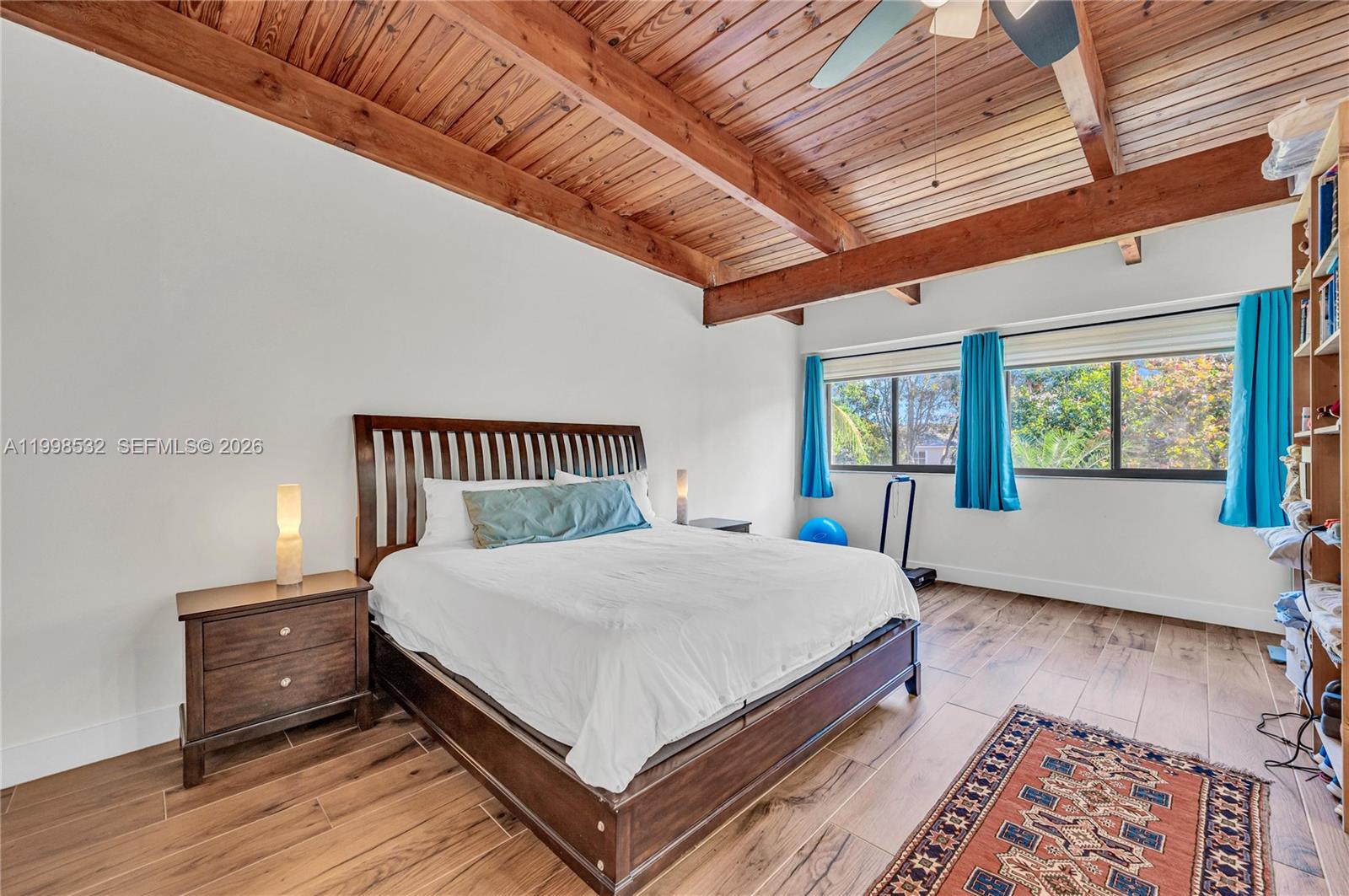 7018 Southwest 53rd Lane Miami, FL 33155 - Photo 25 of 59 a large bed sitting in a bedroom next to a window