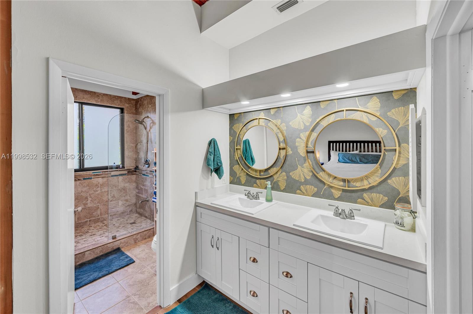 7018 Southwest 53rd Lane Miami, FL 33155 - Photo 29 of 59 a bathroom with a granite countertop sink and a mirror