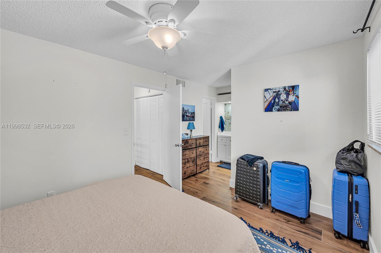 7018 Southwest 53rd Lane Miami, FL 33155 - Photo 36 of 58 a bedroom with a bed and a book shelf