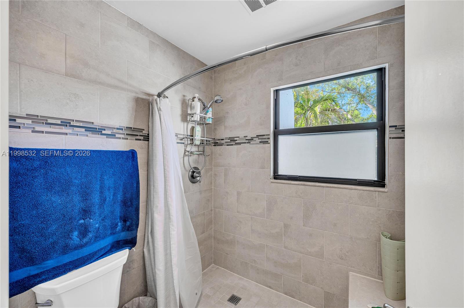 7018 Southwest 53rd Lane Miami, FL 33155 - Photo 39 of 59 a bathroom with a shower and a sink