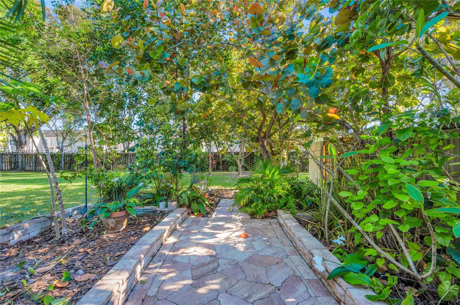 7018 Southwest 53rd Lane Miami, FL 33155 - Photo 44 of 58 a backyard of a house with lots of green space