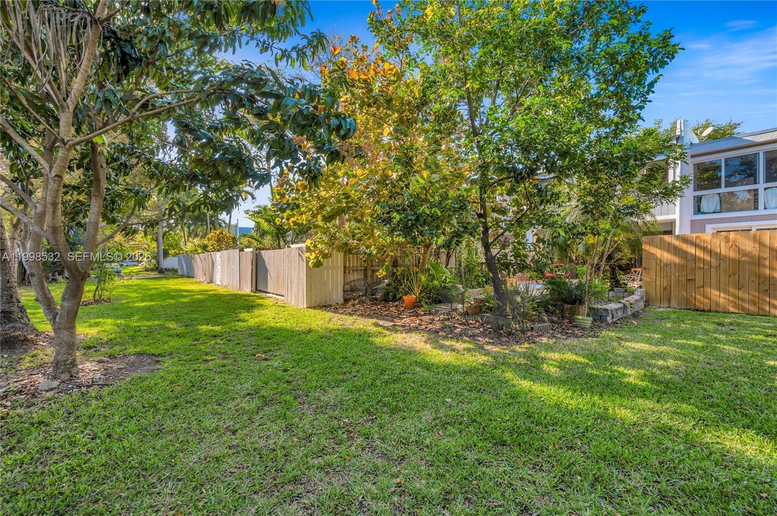 7018 Southwest 53rd Lane Miami, FL 33155 - Photo 48 of 59 a view of a backyard with a tree