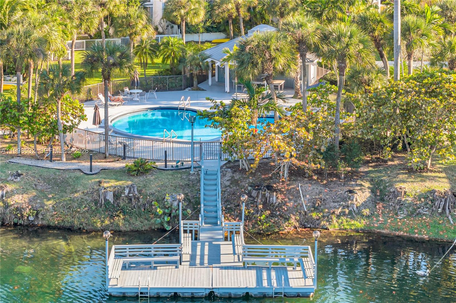 7018 Southwest 53rd Lane Miami, FL 33155 - Photo 51 of 58 a view of a lake with a building in the background
