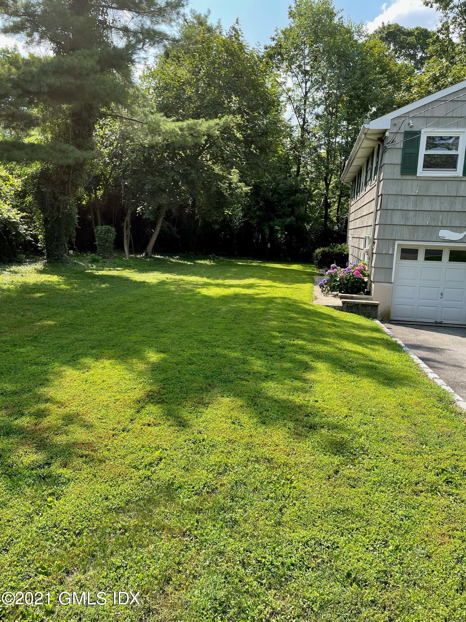 1 Norias Road Greenwich, CT 06830 - Photo 3 of 41 a view of a house with a yard
