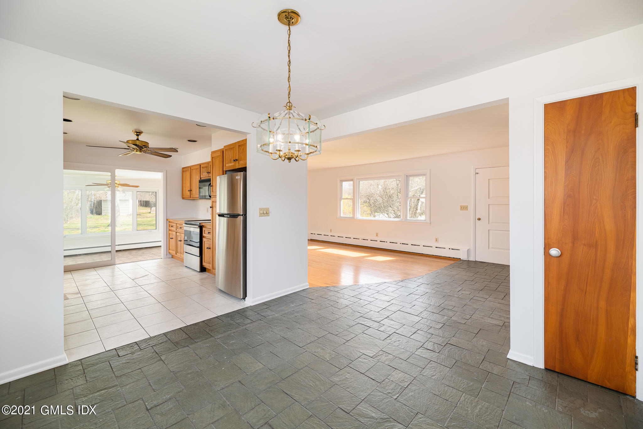 1 Norias Road Greenwich, CT 06830 - Photo 9 of 41 a view of a livingroom with a chandelier