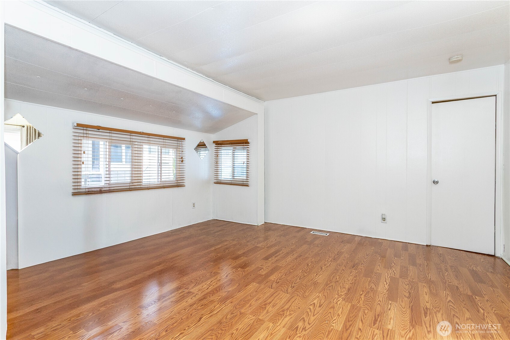 5920 200th Street Southwest, Unit 37 Lynnwood, WA 98036 - Photo 11 of 21 a view of empty room with wooden floor and fan