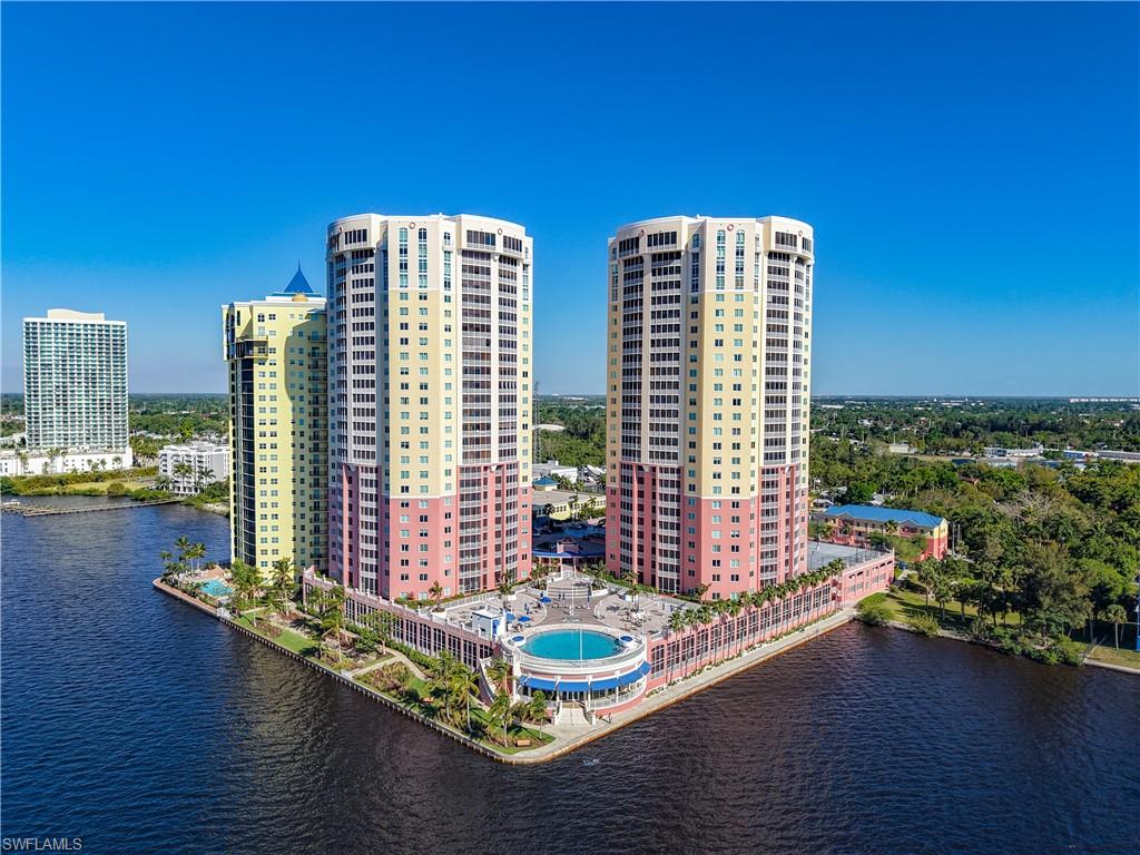 a picture of a room with wooden floor and windows