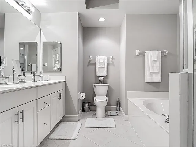 a bathroom with a double vanity sink and a