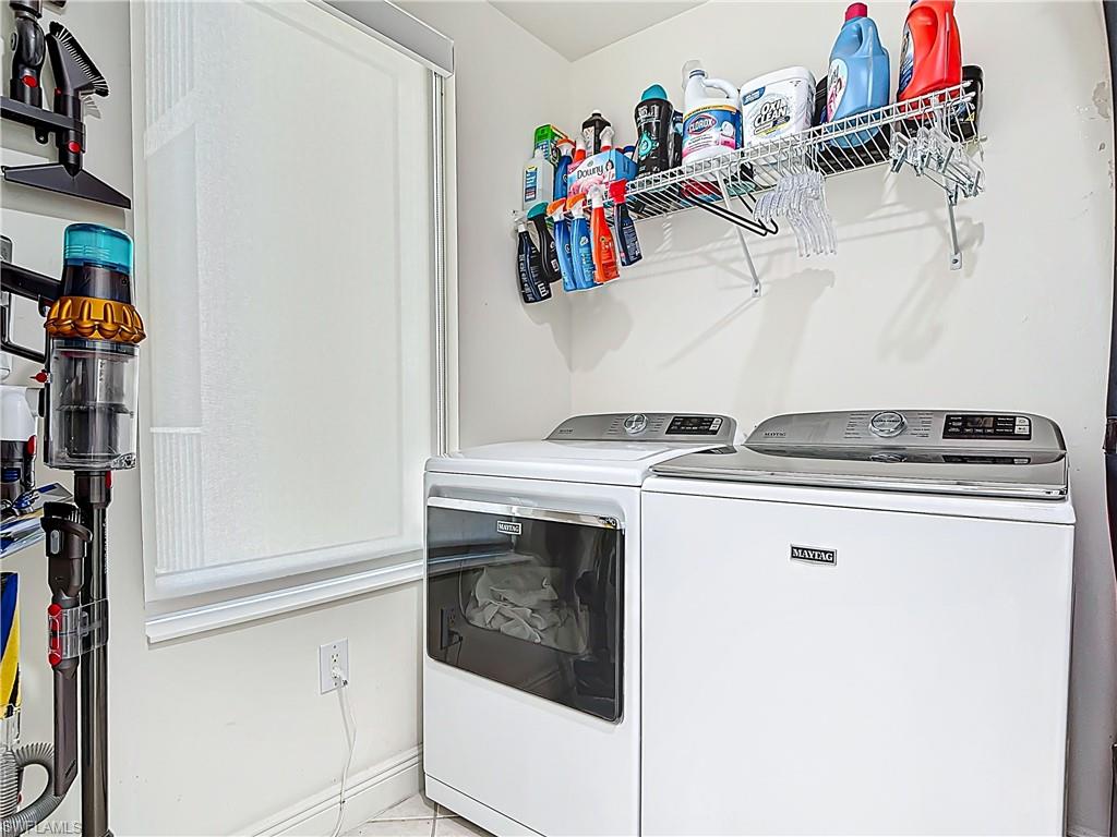 2745 First Street, Unit 1106 Fort Myers, FL 33916 - Photo 18 of 23 a utility room with dryer and washer