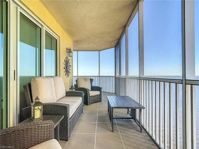 a view of a balcony with furniture
