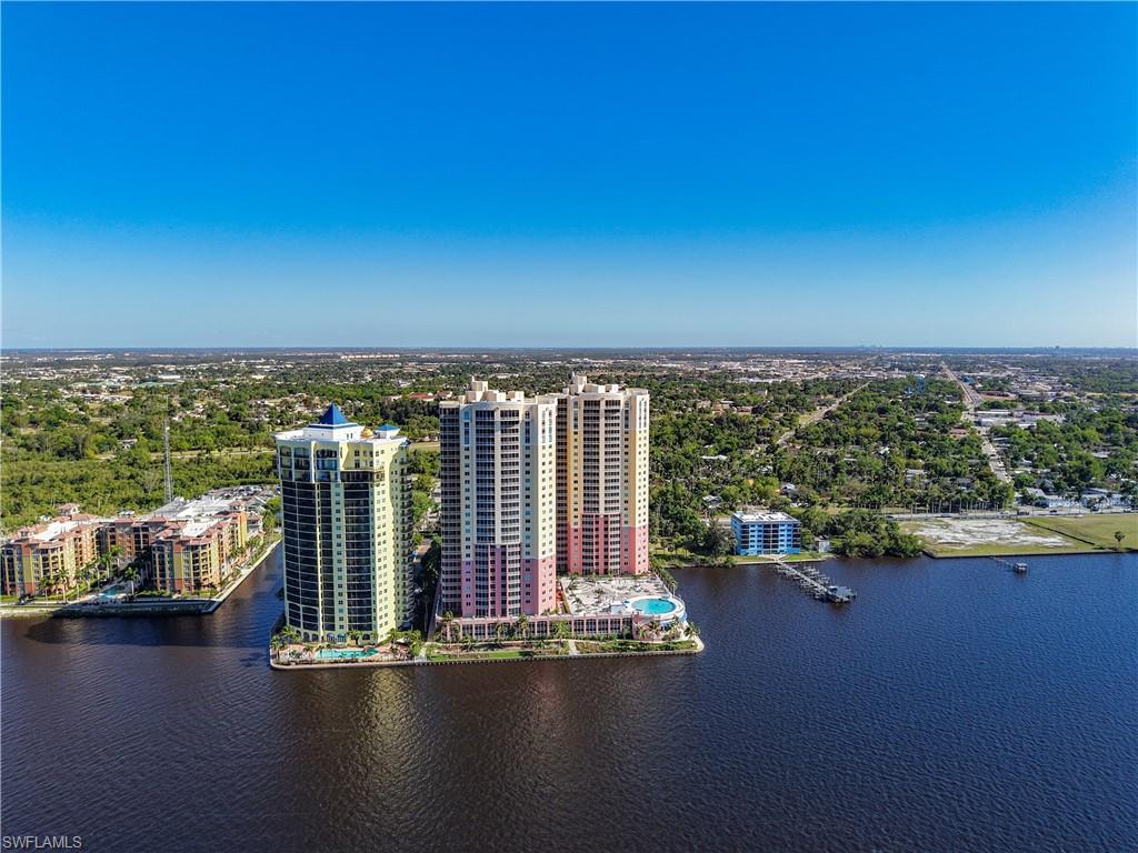 2745 First Street, Unit 1106 Fort Myers, FL 33916 - Photo 23 of 23 an empty room with floor to ceiling window and wooden floor