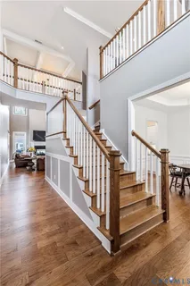 a view of entryway and hall with wooden floor