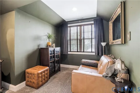 a room with furniture and musical instruments