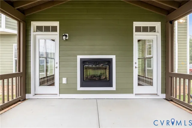a front view of a house with a blue gate
