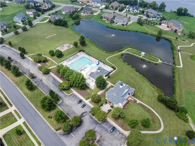an aerial view of a residential houses with outdoor space