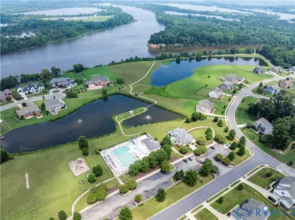 an aerial view of a house with yard swimming pool and outdoor seating