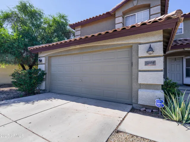 a view of a house with a garage