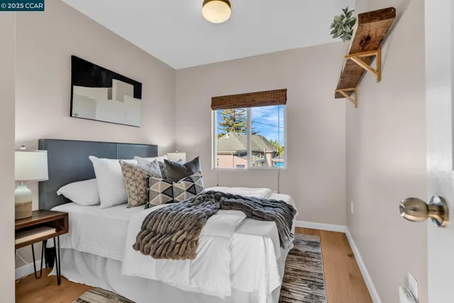 a bedroom with a bed and a couch