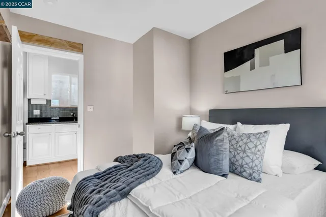 an empty room with wooden floor and closet