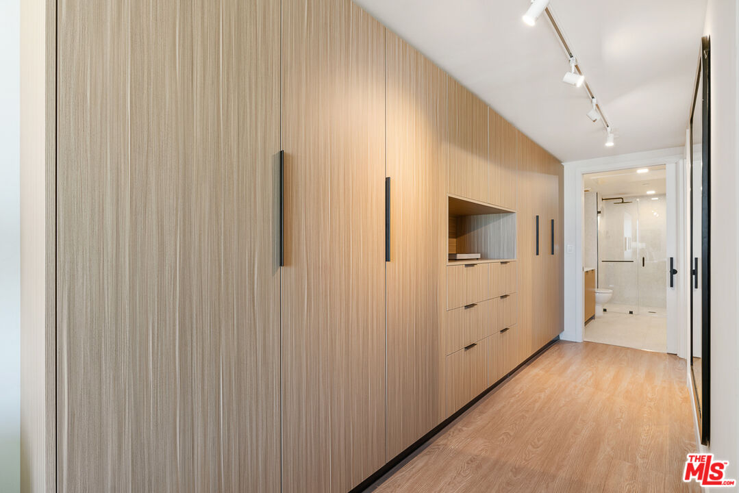 3688 Overland Avenue, Unit 309 Los Angeles, CA 90034 - Photo 11 of 33 a view of a hallway with wooden floor