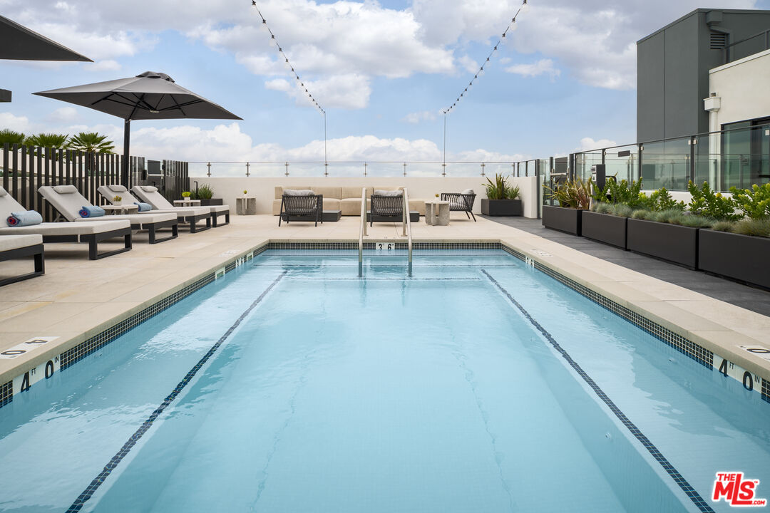 3688 Overland Avenue, Unit 309 Los Angeles, CA 90034 - Photo 16 of 33 a view of a patio with a table and chairs