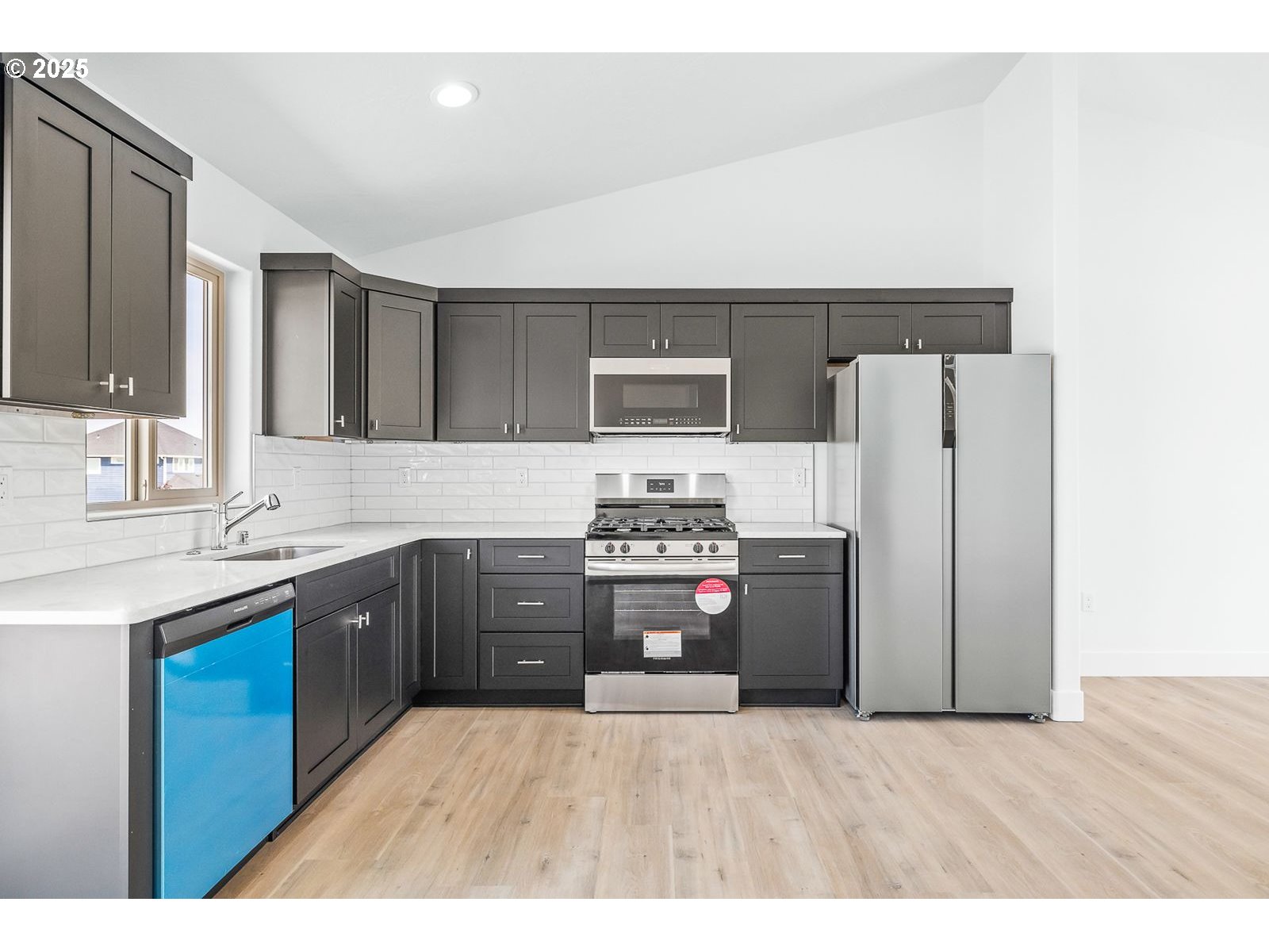 204 Tiber Street Boardman, OR 97818 - Photo 15 of 20 a kitchen with a refrigerator and a sink