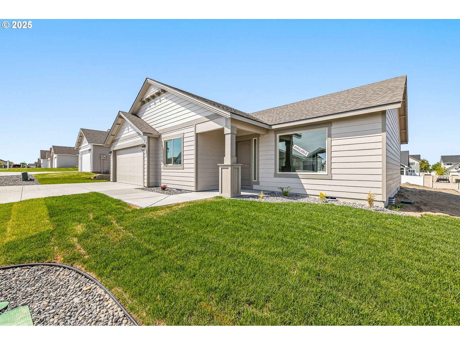 204 Tiber Street Boardman, OR 97818 - Photo 19 of 20 a front view of a house with a yard