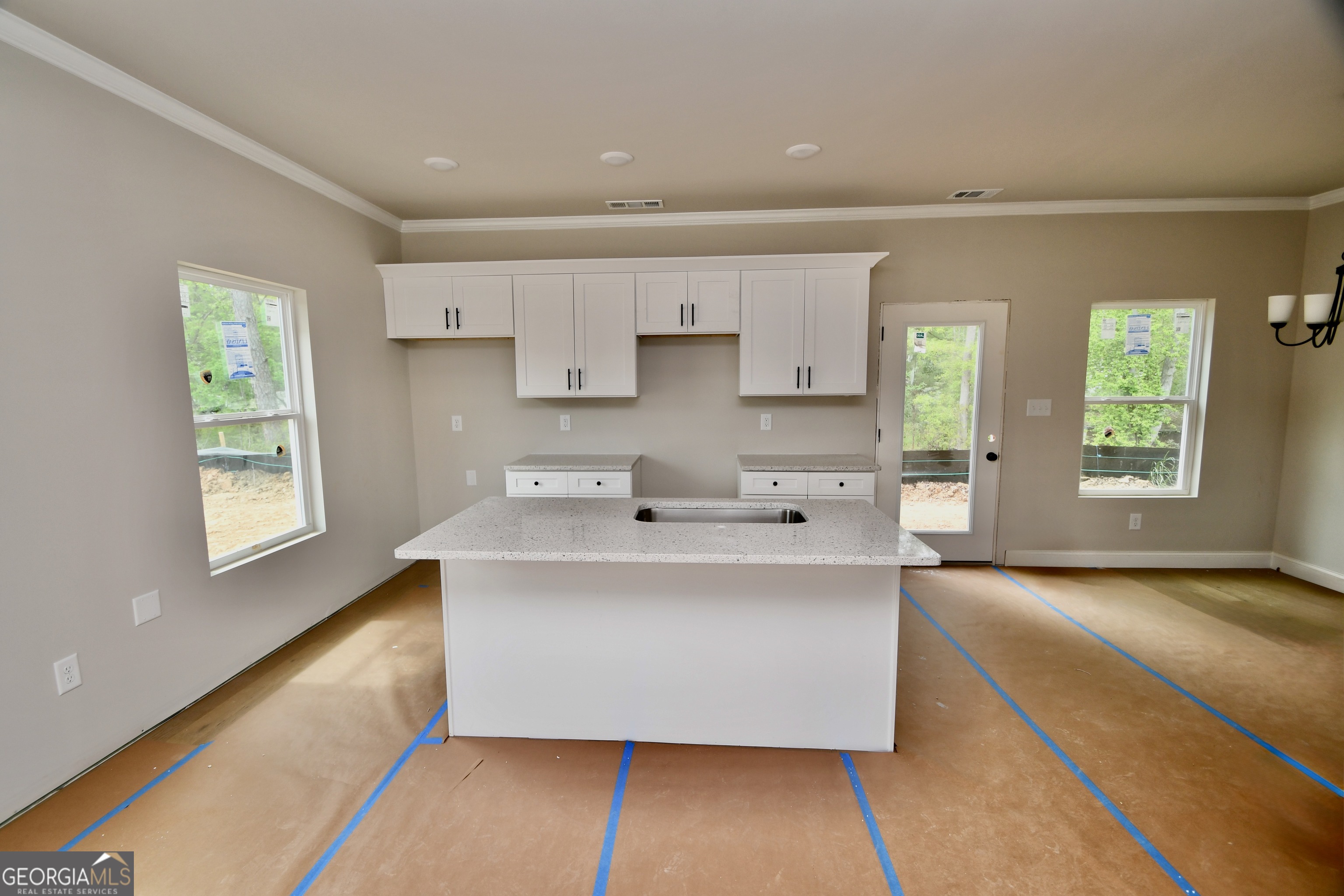 339 Andover Drive Athens, GA 30607 - Photo 2 of 3 a large white kitchen with a large window