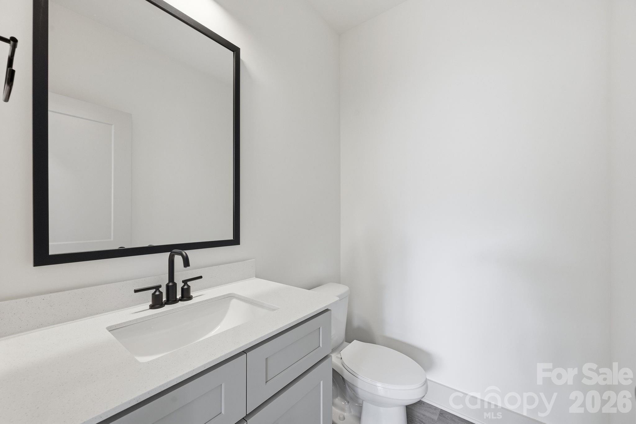 509 Beard Street Monroe, NC 28110 - Photo 18 of 33 a bathroom with a sink and a toilet