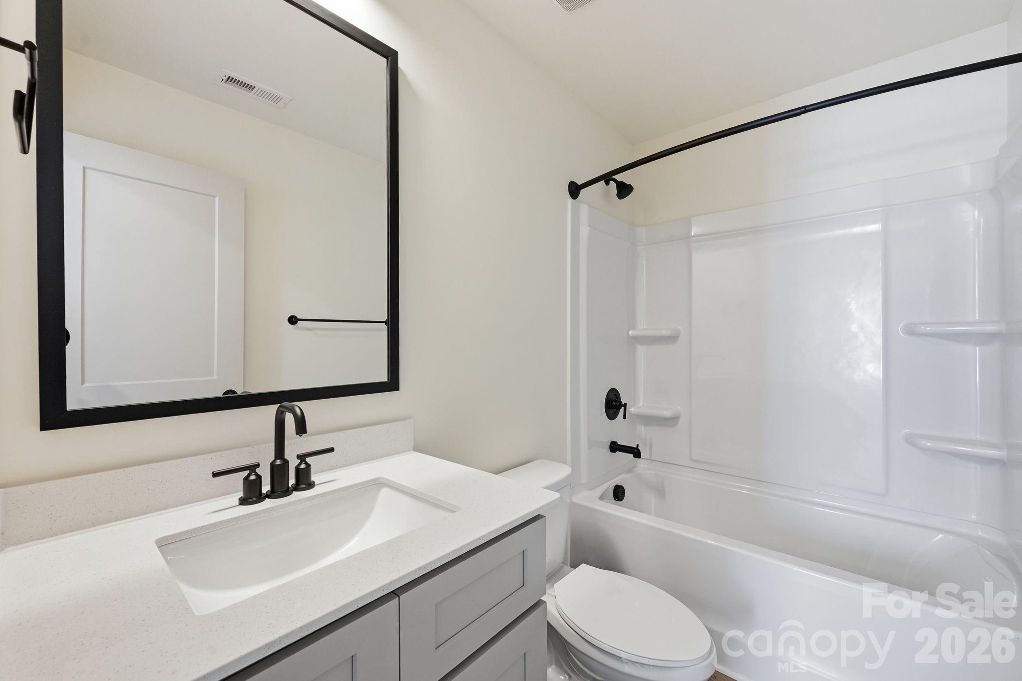 509 Beard Street Monroe, NC 28110 - Photo 20 of 33 a bathroom with a sink toilet bathtub and shower