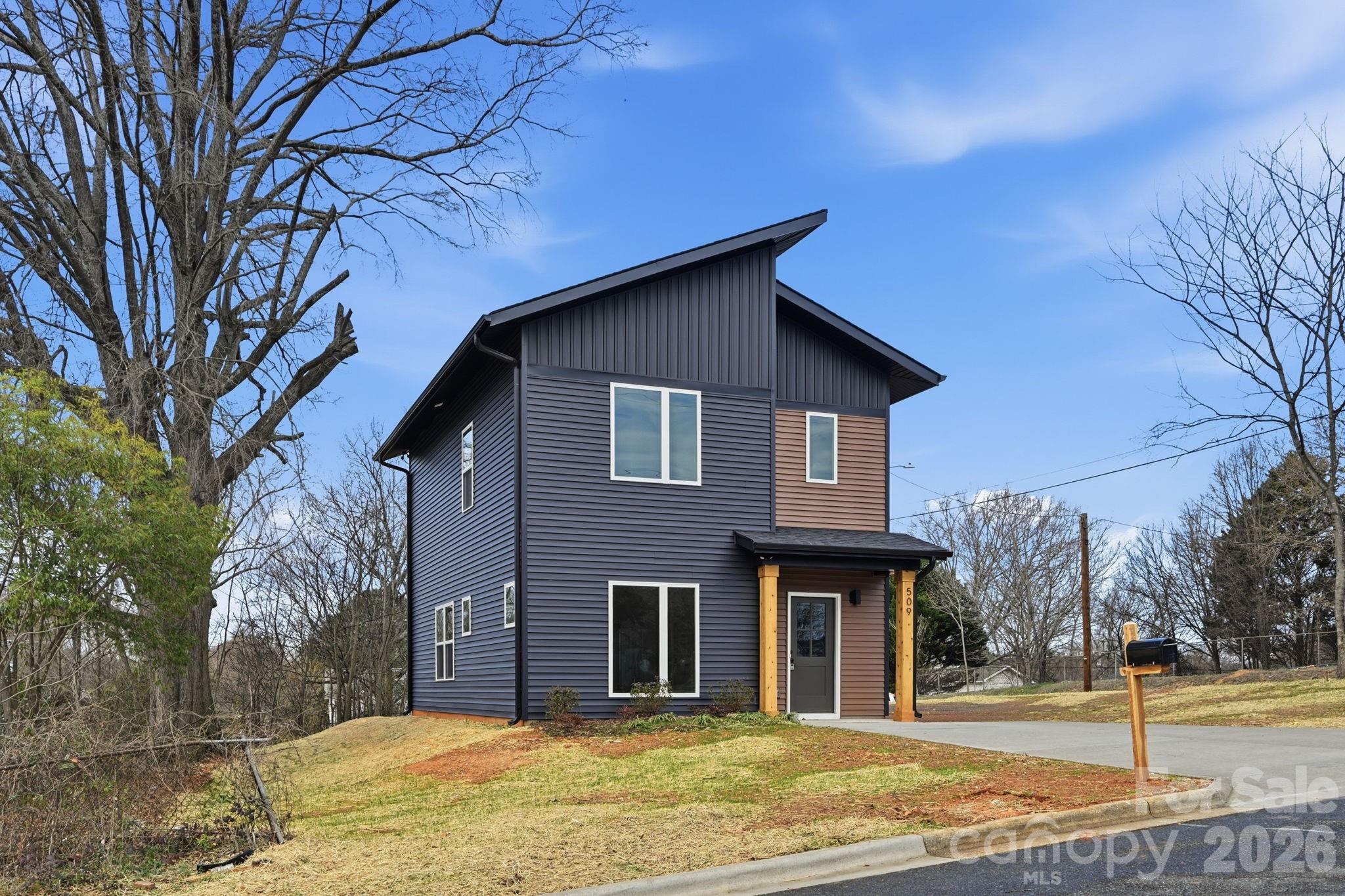 509 Beard Street Monroe, NC 28110 - Photo 2 of 33 a front view of a house with a yard