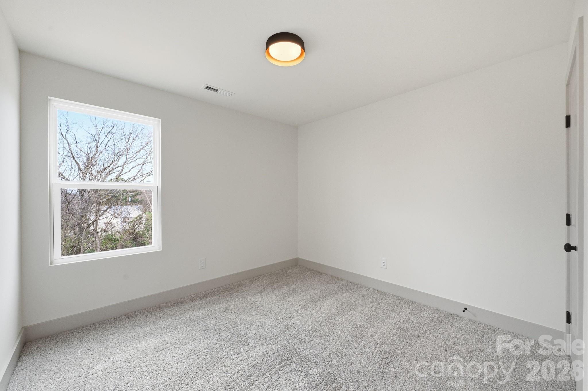 509 Beard Street Monroe, NC 28110 - Photo 26 of 33 an empty room with a window