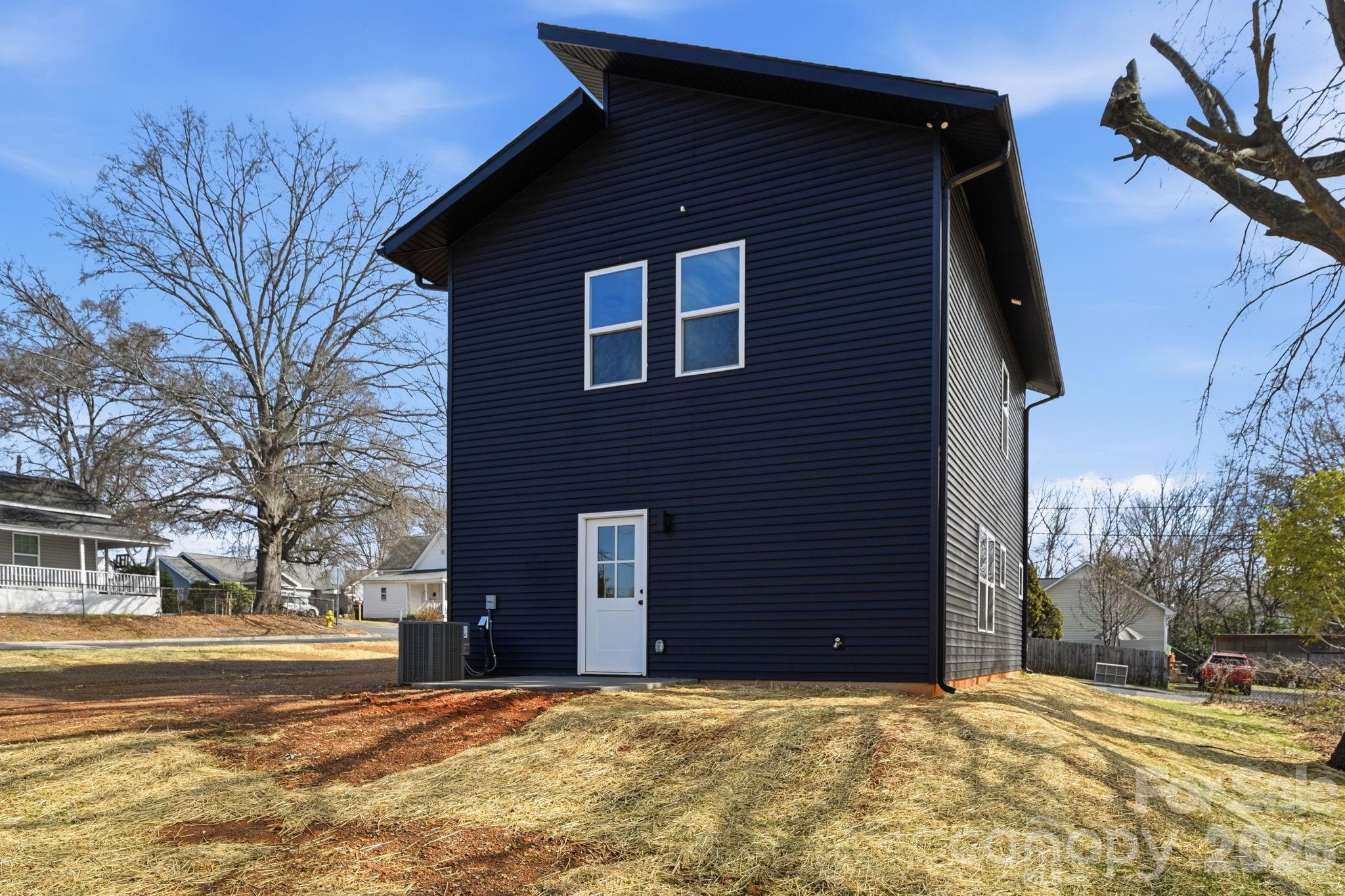 509 Beard Street Monroe, NC 28110 - Photo 32 of 33 a backyard of a house with large trees
