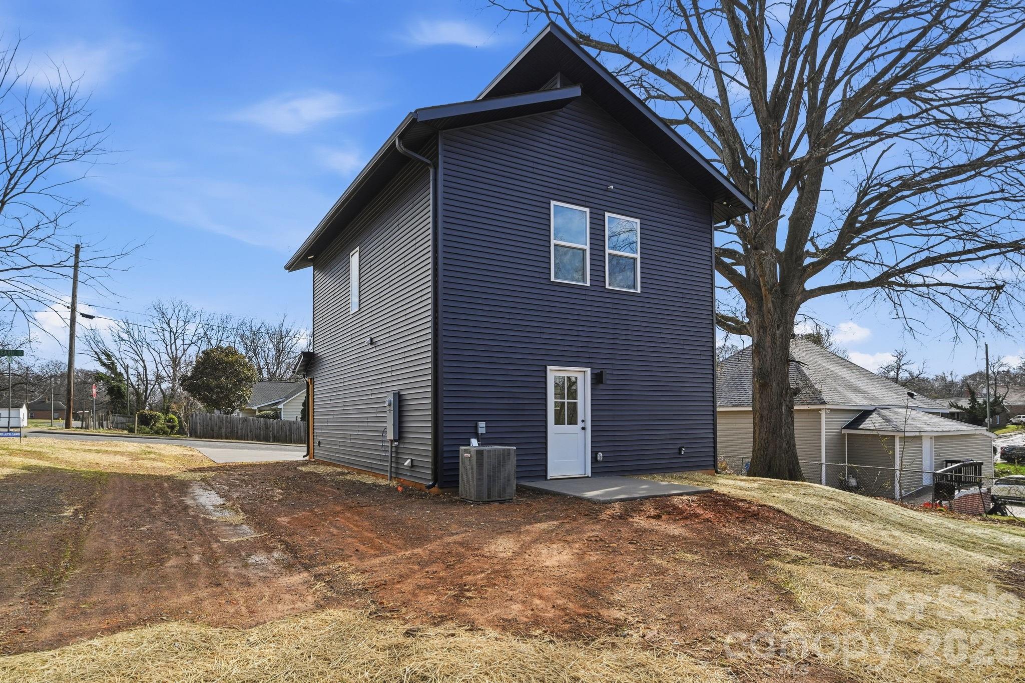 509 Beard Street Monroe, NC 28110 - Photo 33 of 33 a view of a house with a yard and garage
