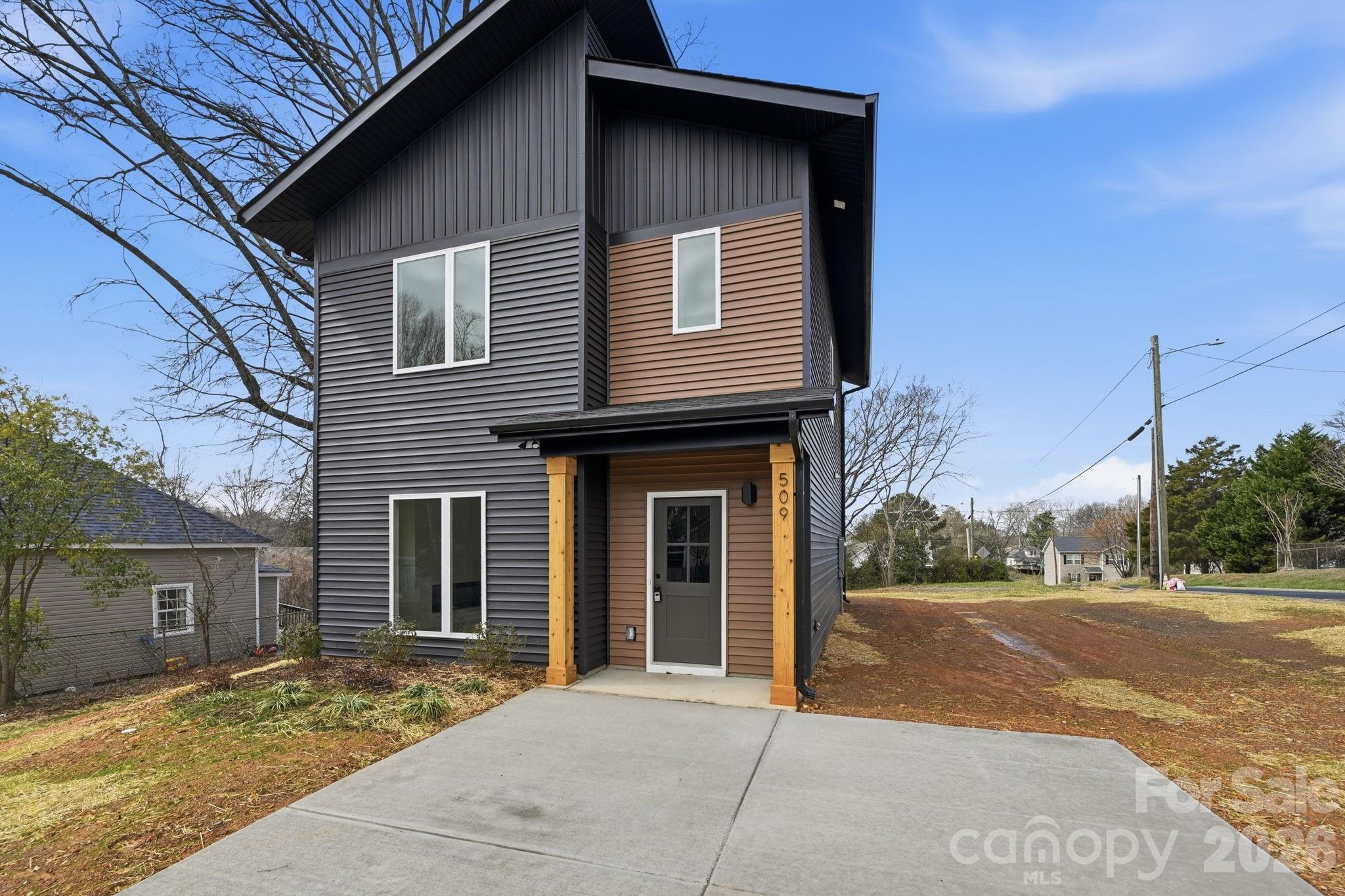 509 Beard Street Monroe, NC 28110 - Photo 4 of 33 a view of a house with a yard