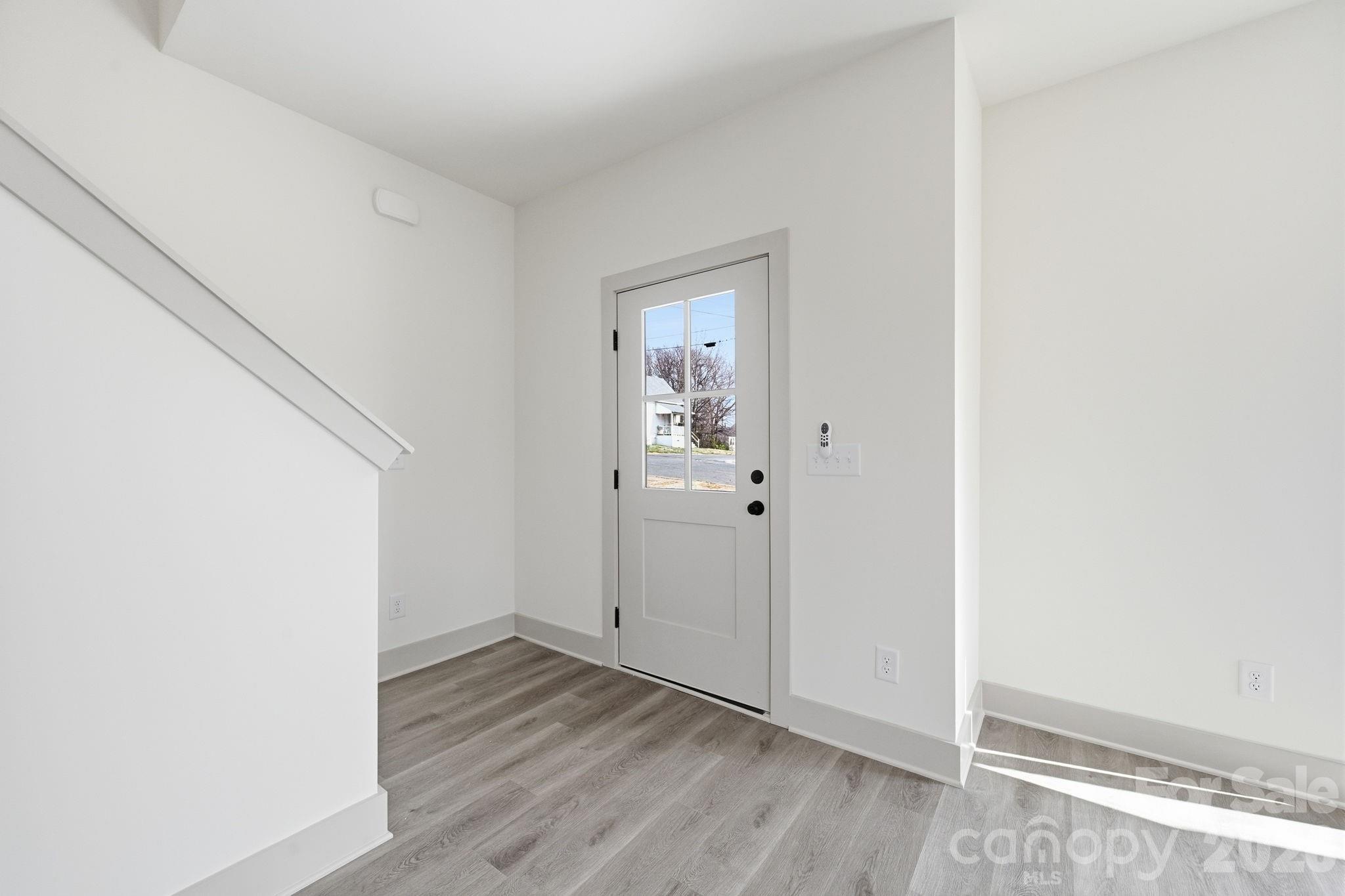 509 Beard Street Monroe, NC 28110 - Photo 5 of 33 a view of hallway with wooden floor