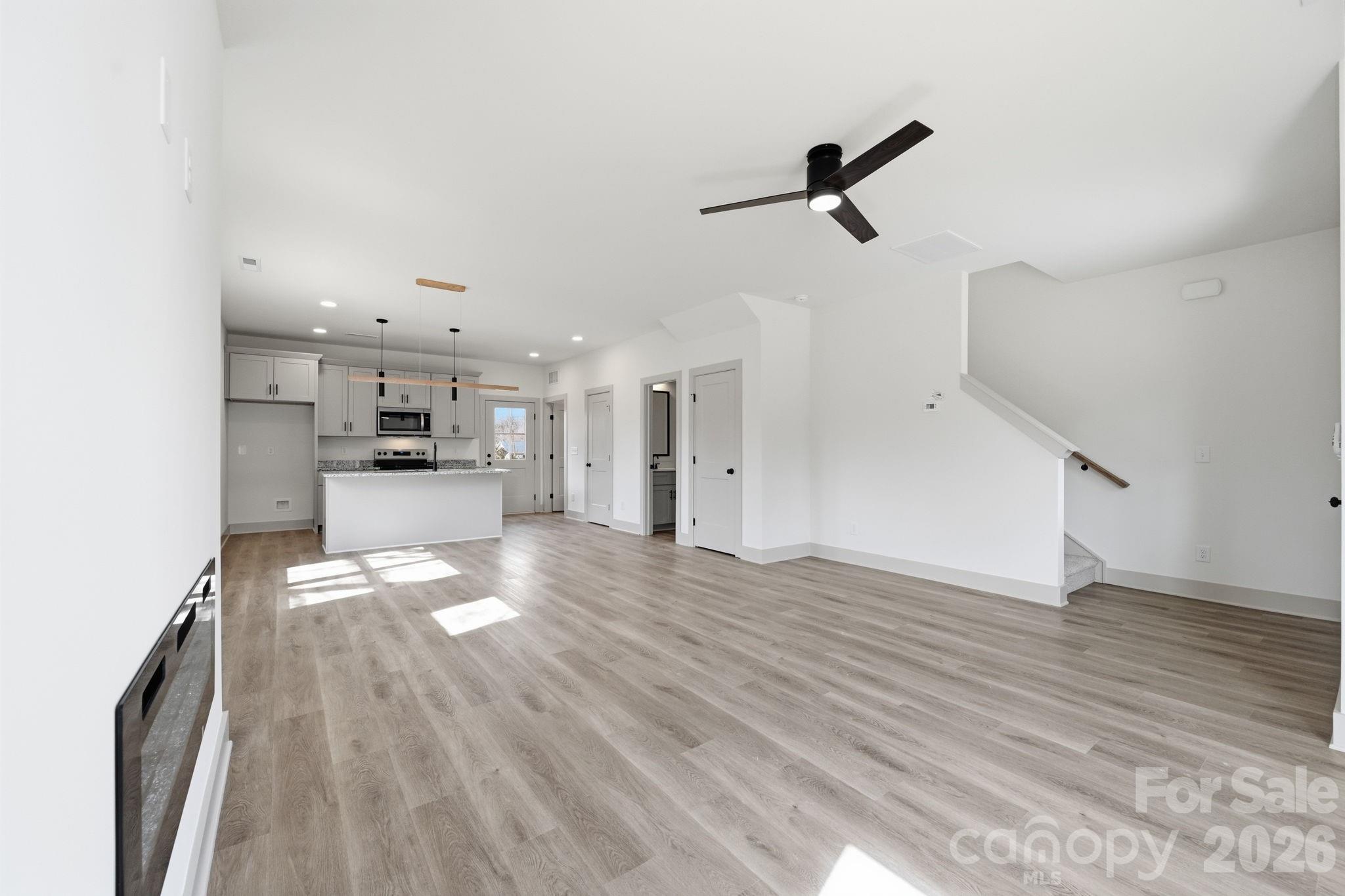 509 Beard Street Monroe, NC 28110 - Photo 7 of 33 a view of empty room with wooden floor